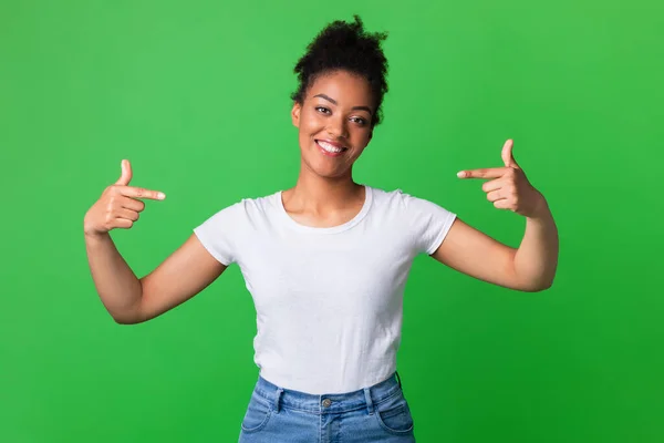 Happy young woman pointing fingers at herself — Stock Photo, Image