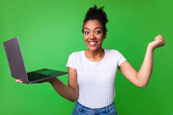 Premium Photo  Lucky day emotional black woman looking at laptop