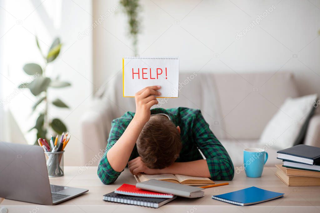 Exhausted schooler asking for help with help placard