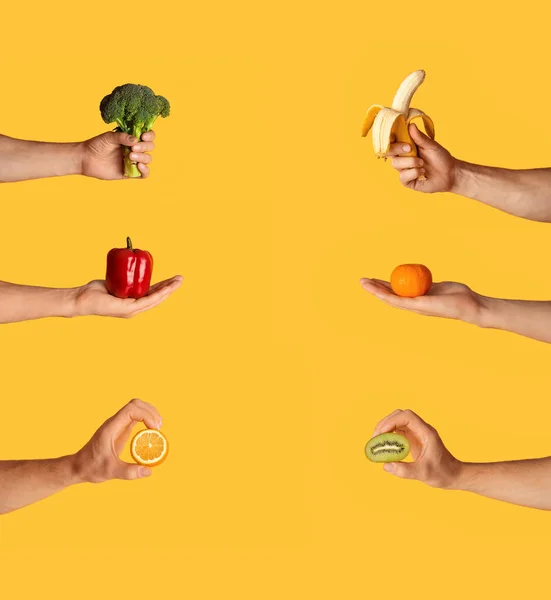 健康饮食。男性手拿着新鲜水果和蔬菜，背景橙色，自由自在的学院 — 图库照片