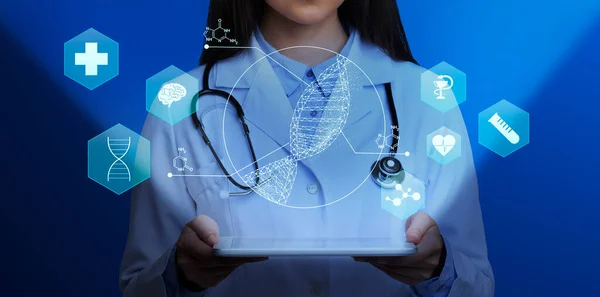 Genética médica. Médica feminina segurando computador tablet com hélice de DNA e outros ícones médicos acima da tela, colagem — Fotografia de Stock