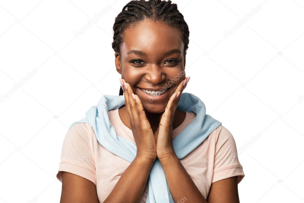 African Girl With Braces Posing Smiling To Camera, White Background