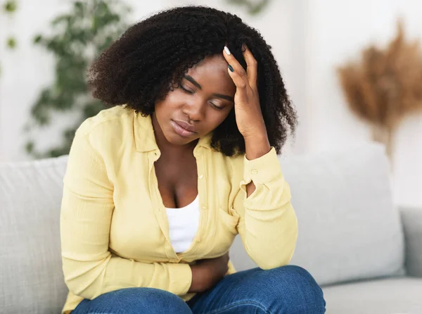 Tired african american woman suffering from pain — Stock Photo, Image