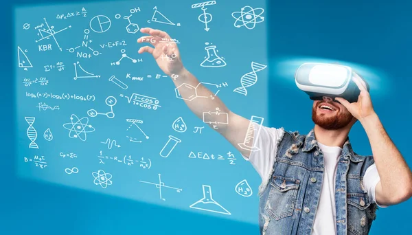 Cheerful man trying vr glasses for studying
