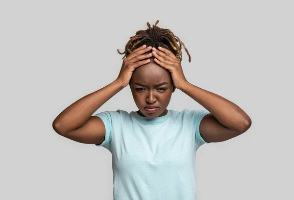 Crying black girl having troubles, touching her head — Stock Photo, Image