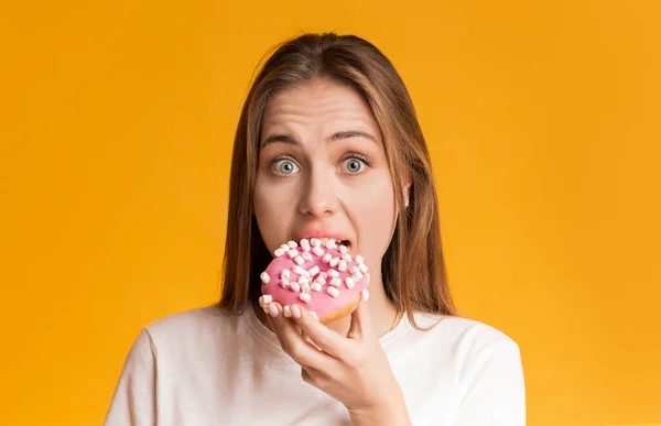 Young Girl Eating Donut, Preferring Unhealthy Food