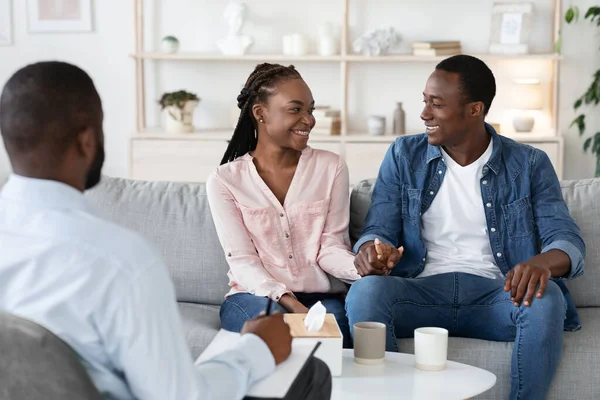 Restored Marriage. Happy Reconciled Black Spouses Holding Hands At Counselors Office — Stock Photo, Image