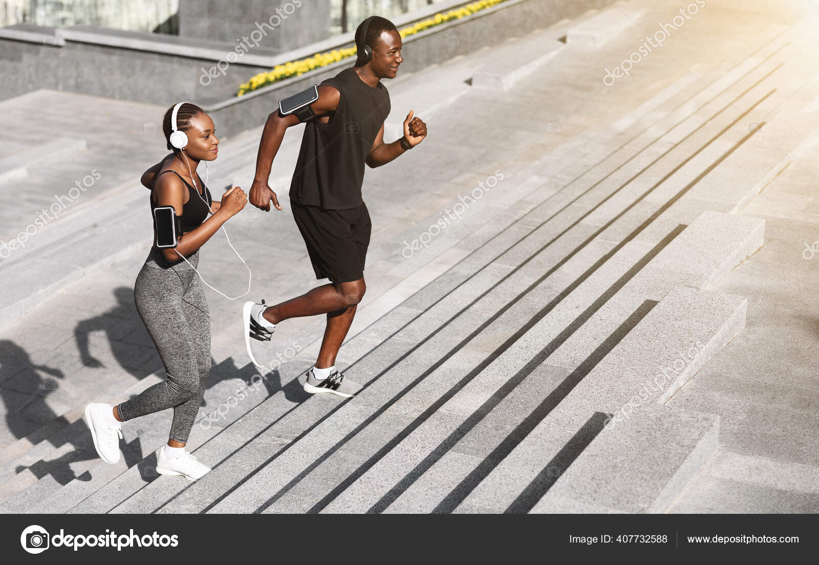 Jogging couple. African american persons man and woman running