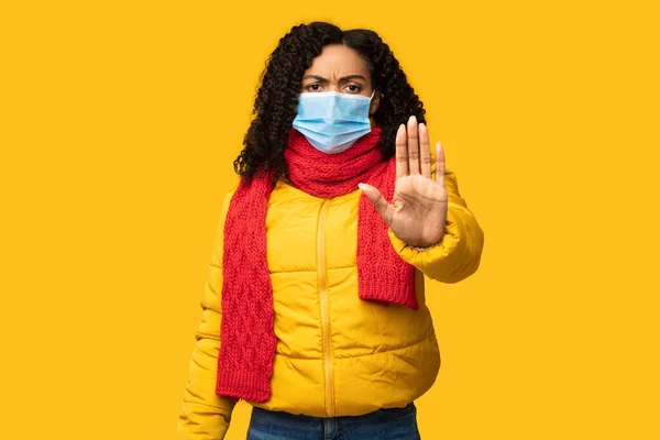 Girl Gesturing Stop Wearing Mask For Coronavirus Protection, Yellow Background
