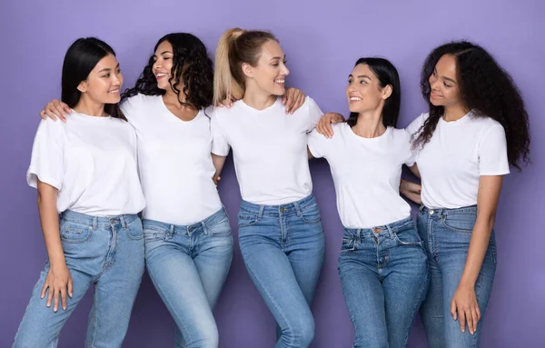 Group Of Multiracial Ladies Embracing Posing Together Over Purple Background