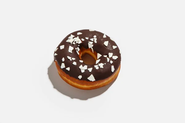 Sweets minimalism concept. Delicious donut with chocolate and white crumb for delivery at home during covid-19 epidemic — Stock Photo, Image