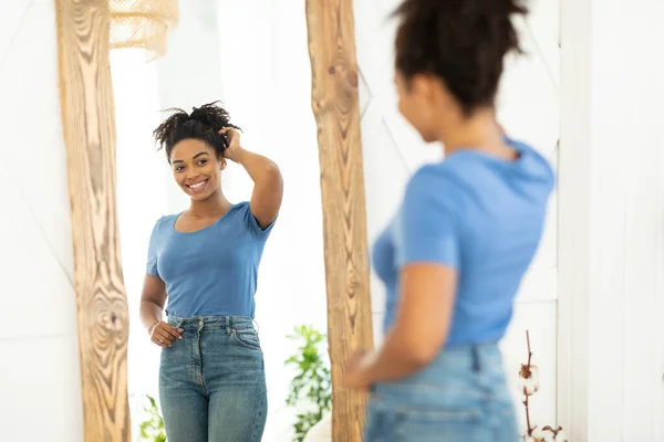 Cheerful African Lady Posing Near Mirror After Slimming At Home