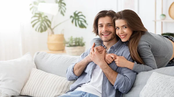 Loving young couple embracing at home, spending time together — Stock Photo, Image