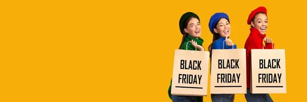 Three Women Holding Shopping Bags With Black Friday Text, Studio — Stock Photo, Image