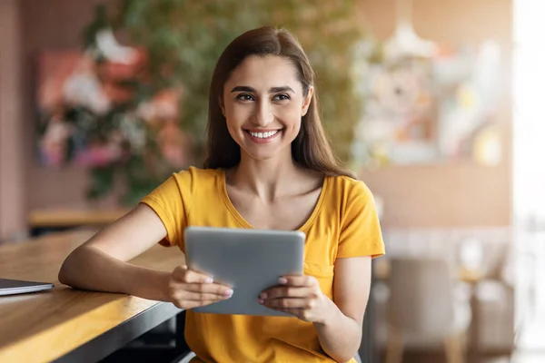 stock image Happy arab lady using digital tablet at cafe