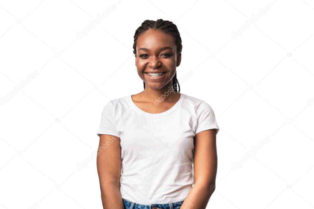 Happy African Lady With Dental Braces Standing Over White Background