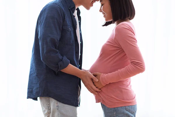Happy Korean Husband Touching Pregnant Wifes Belly Standing At Home — Stock Photo, Image