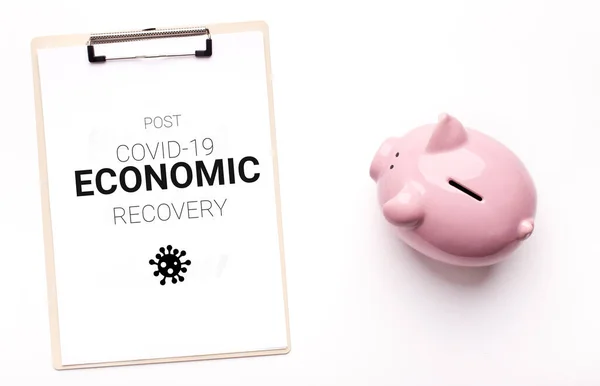 Post Covid-19 Economic Recovery. Conceptual Image With Piggy Bank And Clipboard — Stock Photo, Image