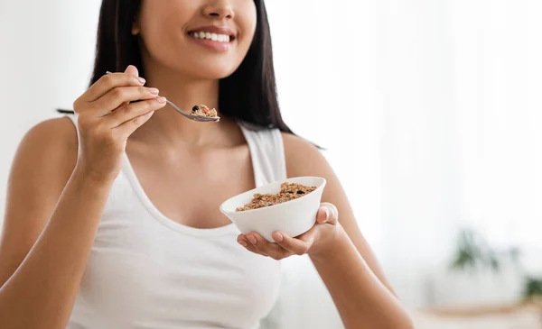 Cropped of asian woman holding bowl with homemade granola — Stock Photo, Image