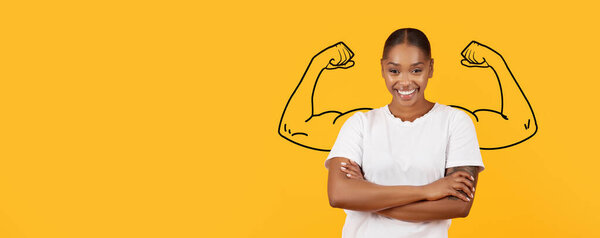 A confident African American woman displays their strength with crossed arms, showcasing biceps against a vibrant yellow background that symbolizes vigor and determination in a motivational setting.
