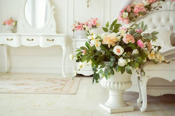 Vintage home decor background with flowers in vase