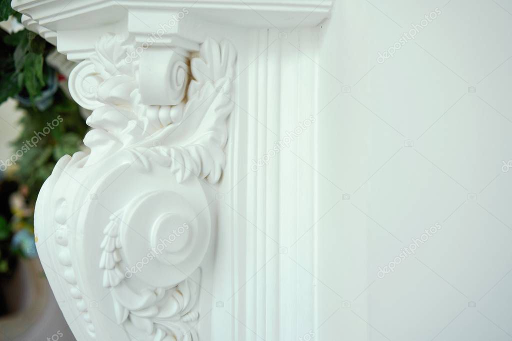 column    is decorated with exquisite elements of plaster moldings                