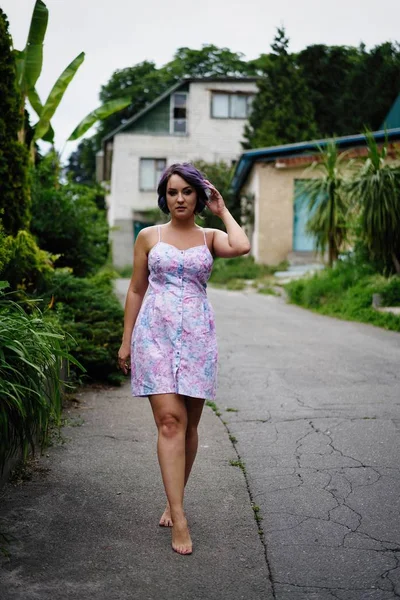 Young attractive woman with colored hair posing