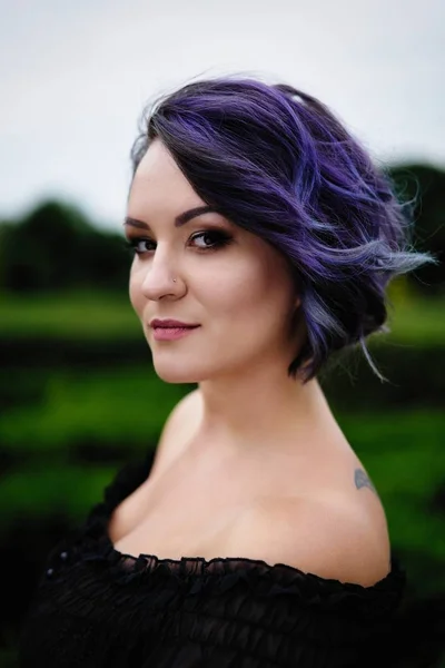 Young attractive woman with colored hair posing