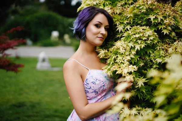 Young attractive woman with colored hair posing