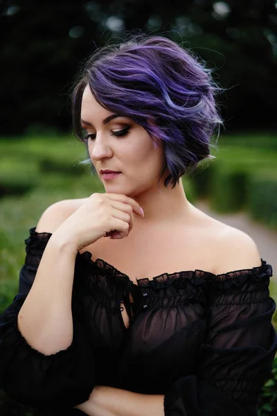 Young attractive woman with colored hair posing