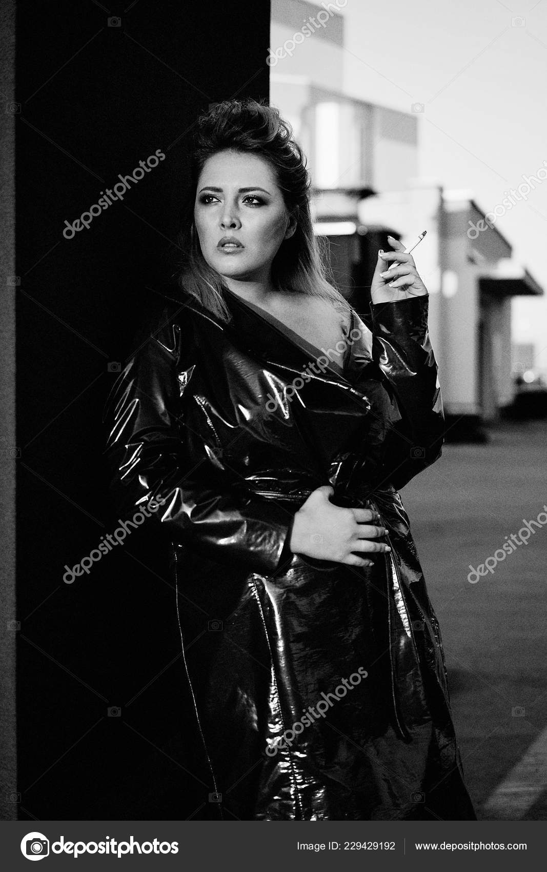 Gorgeous Young Blond Woman Leather Coat Smoking Stock