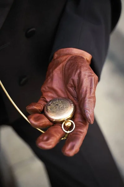 vintage pocket watch in hand close-up view