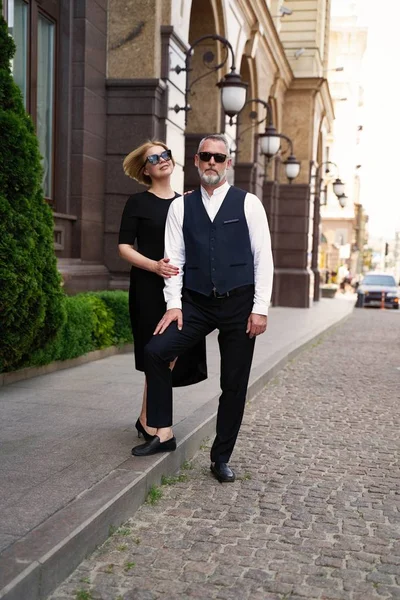 Elegant middle age couple on the street