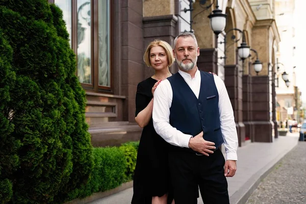 Elegant middle age couple on the street