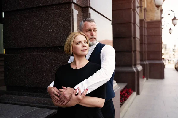 Elegant middle age couple on the street