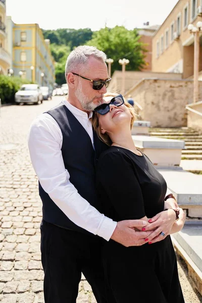 Elegant middle age couple on the street