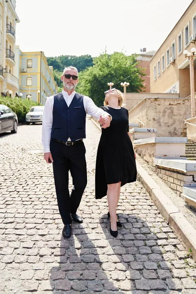 Elegant middle age couple on the street