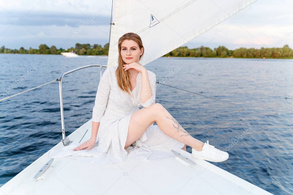 beautiful girl posing at luxury yachts