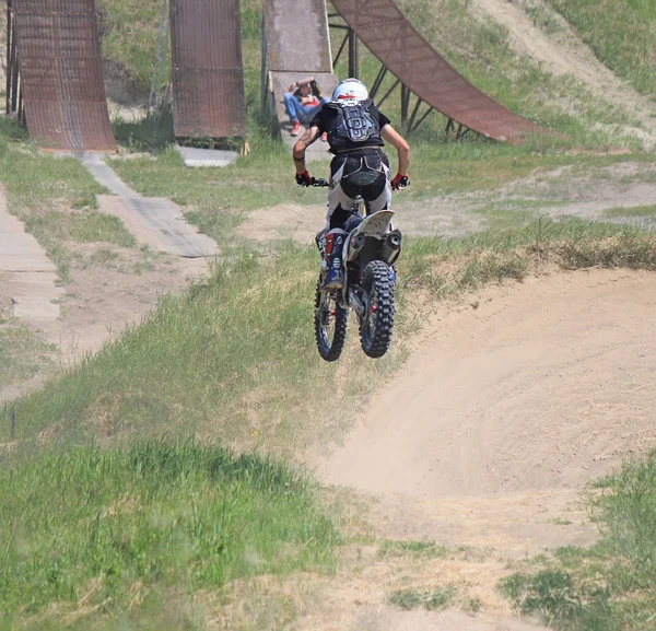 Motorcycle racing in the hills — Stock Photo, Image