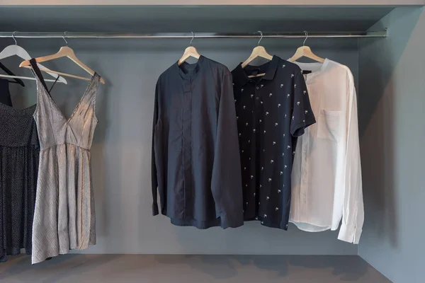 modern closet with clothes hanging