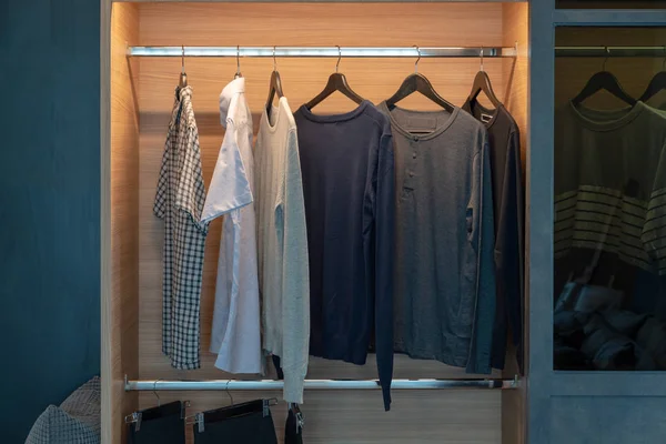 Modern closet with clothes hanging — Stock Photo, Image