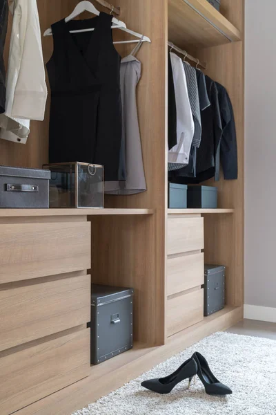 modern closet with clothes