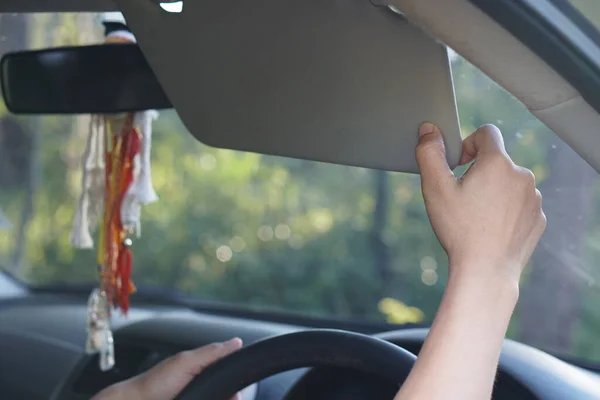 Human hand adjustable car sun visor