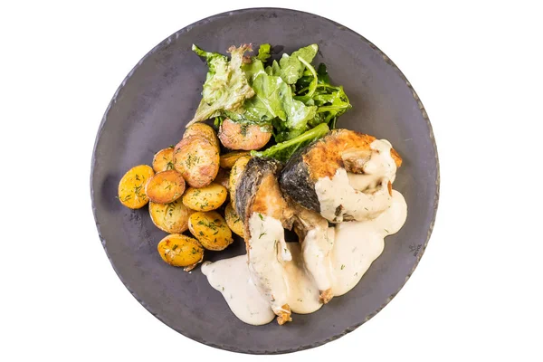 fırında patates soslu balık pişmiş