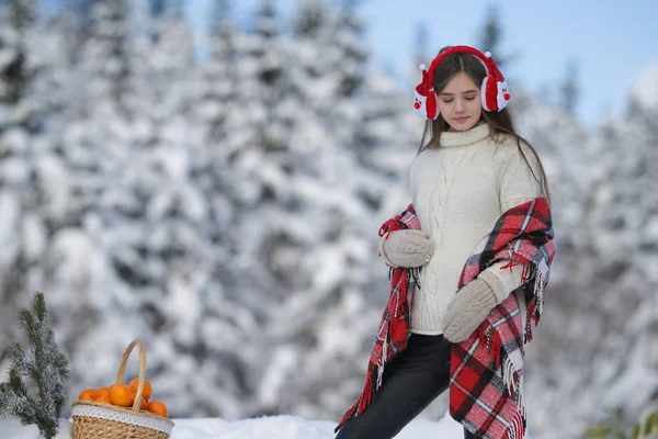 Young Girl Walks Winter Forest Basket Mandarin Headphones Santa Claus — Stock Photo, Image