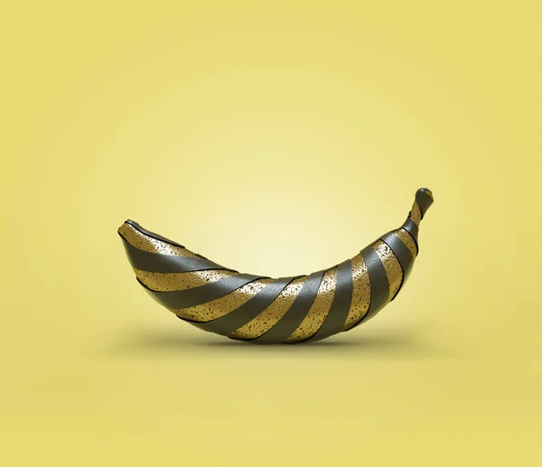Banana de ouro único envolto em listras pretas — Fotografia de Stock