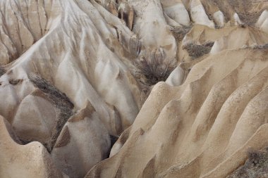 Kum tepeleri arka plan manzara, volkanik kaya oluşumları, Cappadocia.