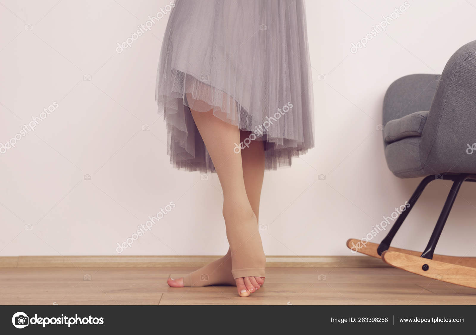 Varicose veins prevention, Compression tights, relief for tired legs.  Beautiful long female legs in stockings Stock Photo