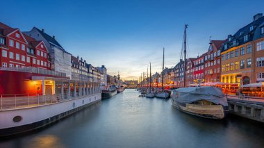 Copenhagen city at night with view of Nyhavn in Denmark.