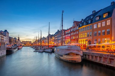 Copenhagen city at night with view of Nyhavn in Denmark.